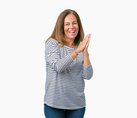 Beautiful middle age woman wearing stripes sweater over isolated background Clapping and applauding happy and joyful, smiling proud hands together