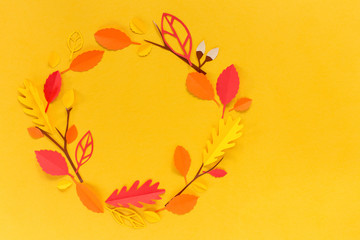 wreath of leaves on an orange background, paper