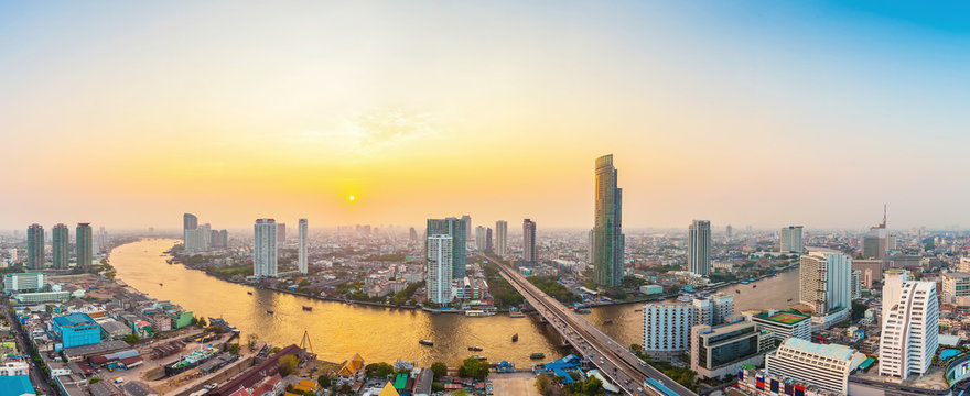 Beautiful view of Bangkok city with Chaopraya river at sunset. Panorama photo.