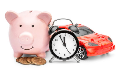  Piggy bank with alarm clock and car toy on white. Time to savings for car.