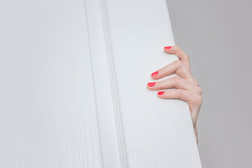 female hand, open door, penetrate into the housing, front view, background, copy space, for...