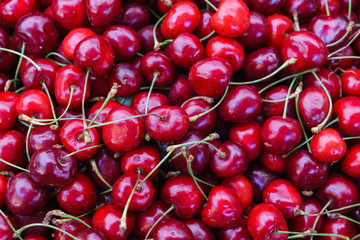 Cherry background, red sweet cherry, photographed from above.