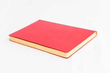 Fototapeta premium Red book, white background, horizontal, blank red copybook, top view