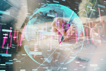 Financial forex graph displayed on hands taking notes background. Concept of research. Multi exposure