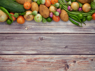 Fresh local vegetables in Asia on a wooden table