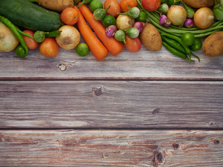 Fresh local vegetables in Asia on a wooden table