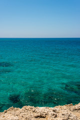 Obraz premium unreal blue and clear sea and rocks off the coast of Ayia Napa, Cyprus
