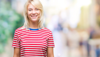 Young beautiful blonde woman over isolated background with a happy and cool smile on face. Lucky person.