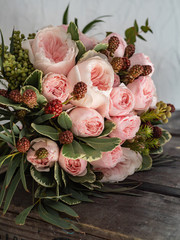 Beautiful wedding bouquet of shrub and peony gently pink roses.