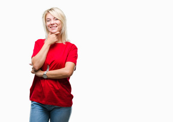 Young beautiful blonde woman wearing red t-shirt over isolated background looking confident at the camera with smile with crossed arms and hand raised on chin. Thinking positive.