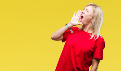 Young beautiful blonde woman wearing red t-shirt over isolated background shouting and screaming loud to side with hand on mouth. Communication concept.
