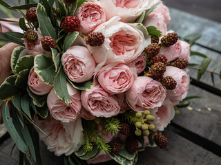 Beautiful wedding bouquet of shrub and peony gently pink roses.