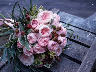 Beautiful wedding bouquet of shrub and peony gently pink roses.