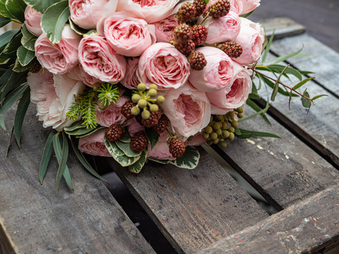 Beautiful wedding bouquet of shrub and peony gently pink roses.