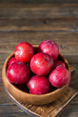 Red plum. Healthy diet. Rustic style