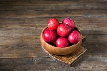 Red plum. Healthy diet. Rustic style