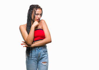 Young braided hair african american with pigmentation blemish birth mark over isolated background looking confident at the camera with smile with crossed arms and hand raised on chin.