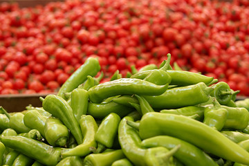 Fresh green peppers At the end of the red tomatoes fade