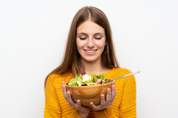 Young woman with long hair with salad