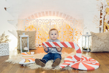 New Year decorations near the fireplace, a small child