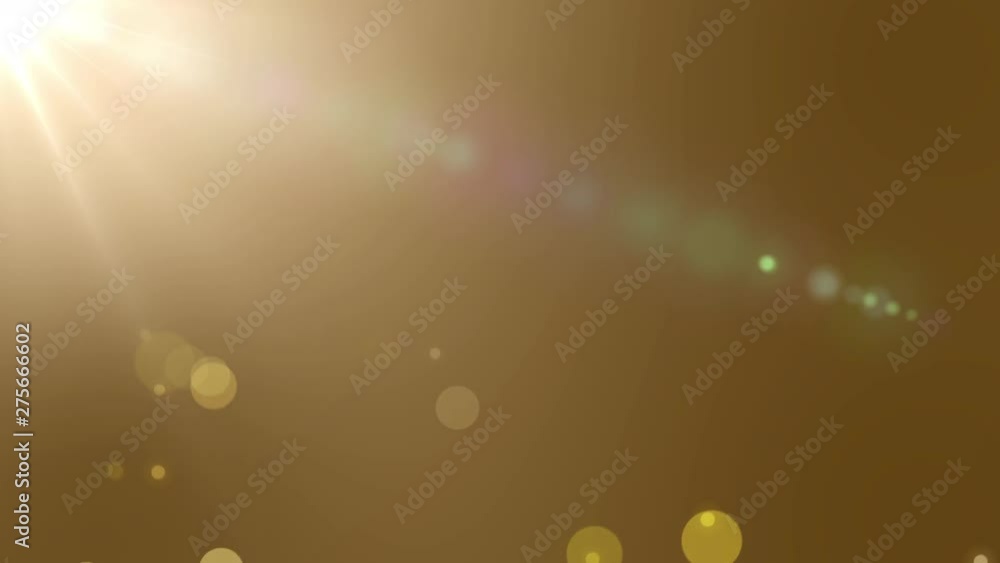 Poster sparkling gold glitters with bright sun flares background glowing yellow bokeh lights abstract luxur