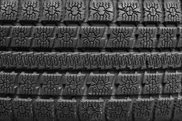 Old tire texture background. Worn black tire tread