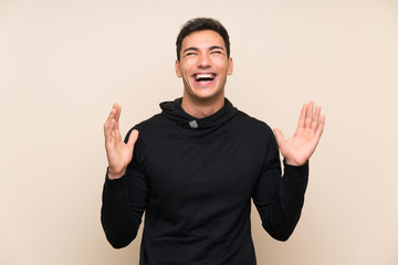 Handsome man over isolated background laughing