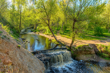 Waterfall on the river Sablinka in the village of Ulyanovsk, Leningrad region.