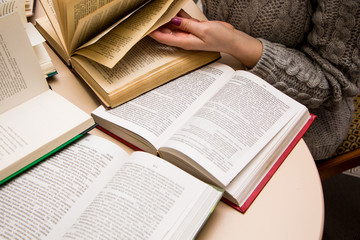 hand of a woman on old book