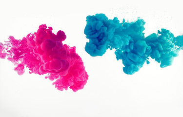explosion of blue and mangenta color in water