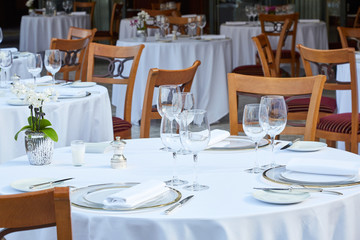 Outdoor luxury restaurant tables and chairs in summer
