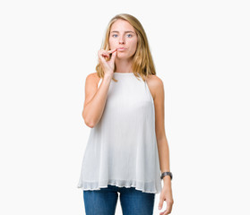 Beautiful young elegant woman over isolated background mouth and lips shut as zip with fingers....