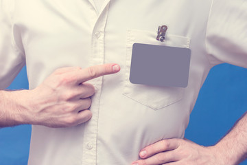 Man showing badge card, men's hand, toned