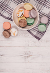 Traditional french dessert of colorful macaron set on white table background. Delicious sweet food.