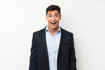 Handsome man over isolated white wall with surprise facial expression