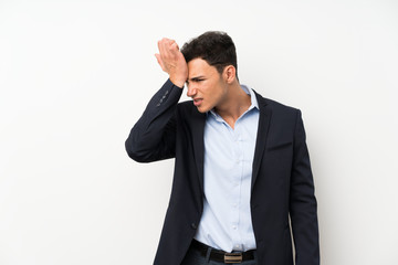 Handsome man over isolated white wall having doubts with confuse face expression