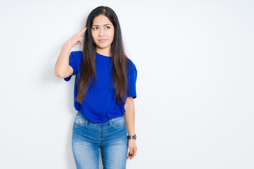 Obraz premium Beautiful brunette woman over isolated background Shooting and killing oneself pointing hand and fingers to head, suicide gesture.