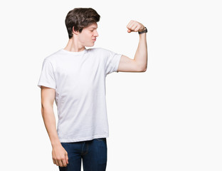 Young handsome man wearing casual white t-shirt over isolated background Strong person showing arm muscle, confident and proud of power