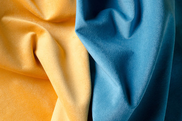 Yellow and blue soft velour fabric. Colors of ukrainian flag. Fabric texture background.