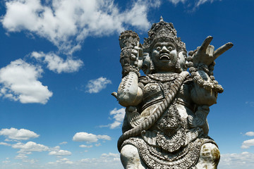 Fototapeta na wymiar Stone carved statue of Barong in hindu temple in Bali-Indonesia