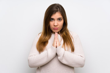 Young girl with white sweater pleading