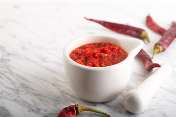 Traditional Maghrebi hot chili pepper sauce paste harissa. Tunisia and Arabic