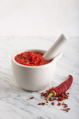 Traditional Maghrebi hot chili pepper sauce paste harissa. Tunisia and Arabic