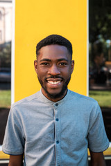 Portrait of young afro american man in the street.