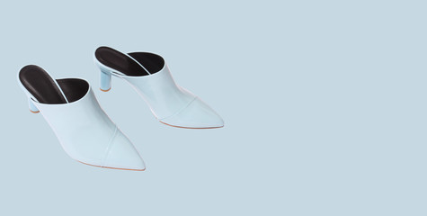Sky blue shoes over bluish background, copy space