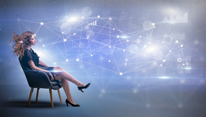 Elegant woman sitting in a sofa with network and connection concept
