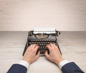 First person perspective elegant hand writing on an oldschool typewriter with copyspace
