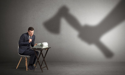 Shadow threatening hard worker man who is afraid
