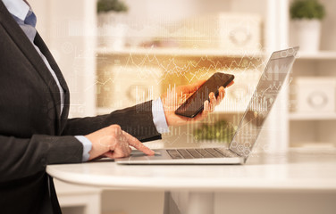 Business woman in homey environment using laptop with global financial report concept
