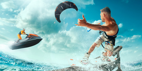 Kite surfing and water scooter in tropical ocean.